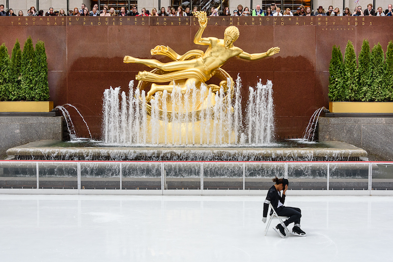 Elladj Balde sits in a chair on ice and tilts his hat in the style of Michael Jackson